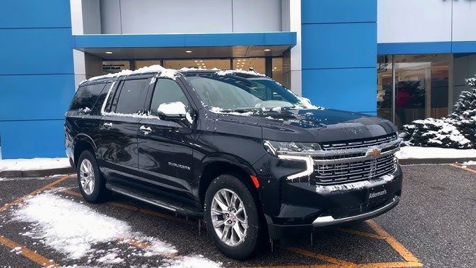 Black Chevrolet Suburban parked in snowy conditions luxury SUV limo service by United Limo INC.